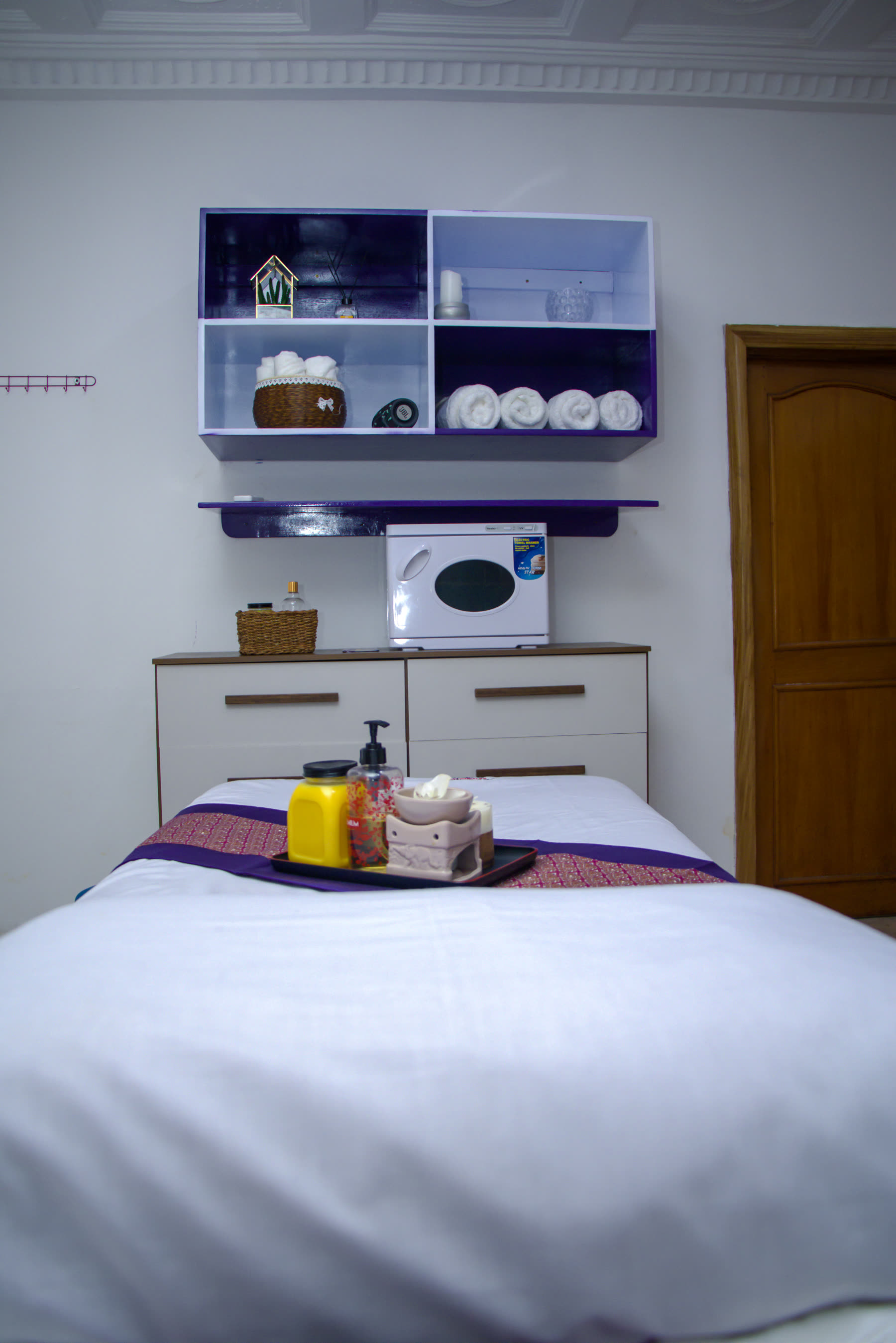 Beckindales massage room with fresh towels, oils and treatment bed