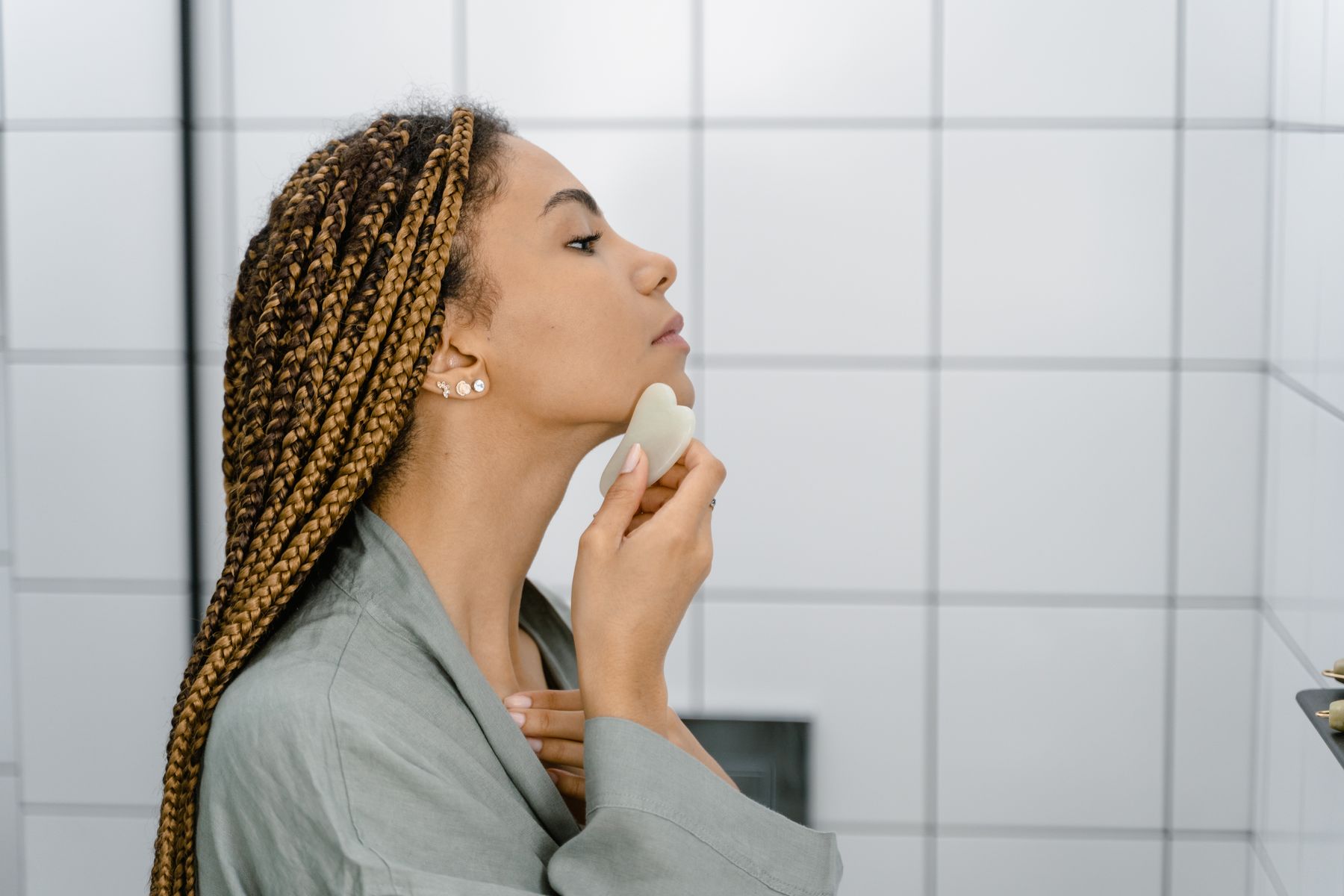 Gua Sha stone used during a gentle massage treatment