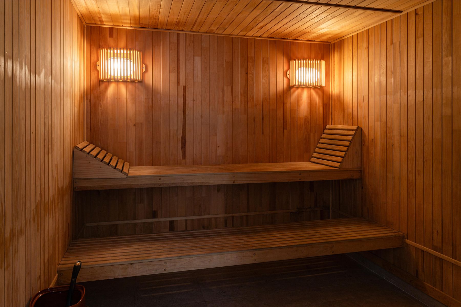 Warm wooden sauna interior with soft lighting